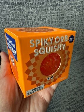 BNIB J’adore Spiky Orb Squishy, Orange